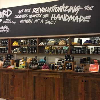 Lush products on a table and shelves.