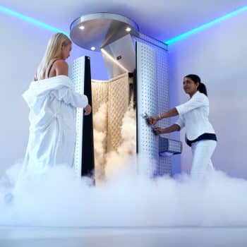 Full length woman entering cryotherapy treatment