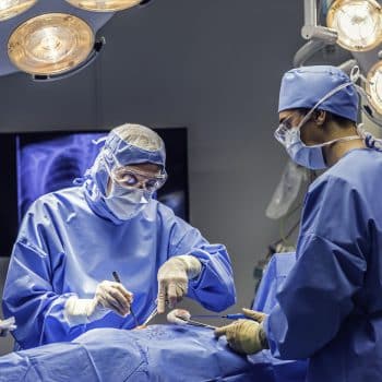 Doctors team in operating room emergency hernia surgery