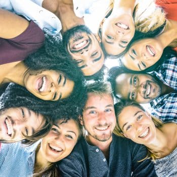 Multiracial best friends millennials taking selfie outdoors with back lighting - Making friends as an adult