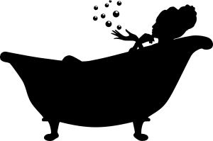black silhouette of a bathtub and a woman in it blowing bubbles.