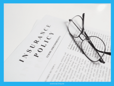 A close-up image of an insurance policy document with the title 'Insurance Policy Terms and Conditions' partially visible. A pair of round, black-rimmed glasses rests on top of the document. The background is framed with a blue border, and the website 'www.ez.insure' is displayed at the bottom.